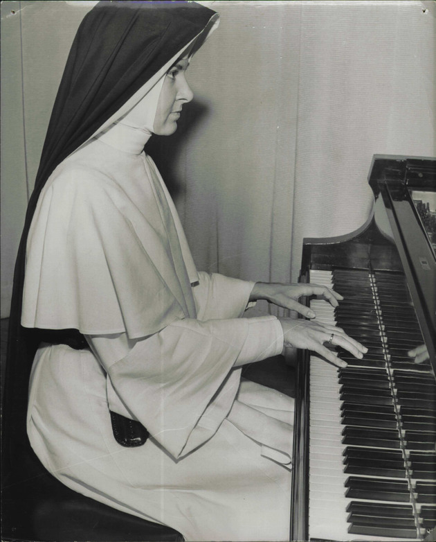 Sister Michael Elise playing piano
